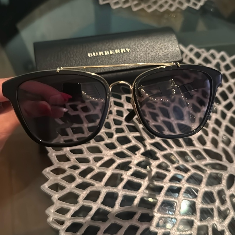 Beautiful condition Burberry sunglasses. Hard case included. Gold and black.